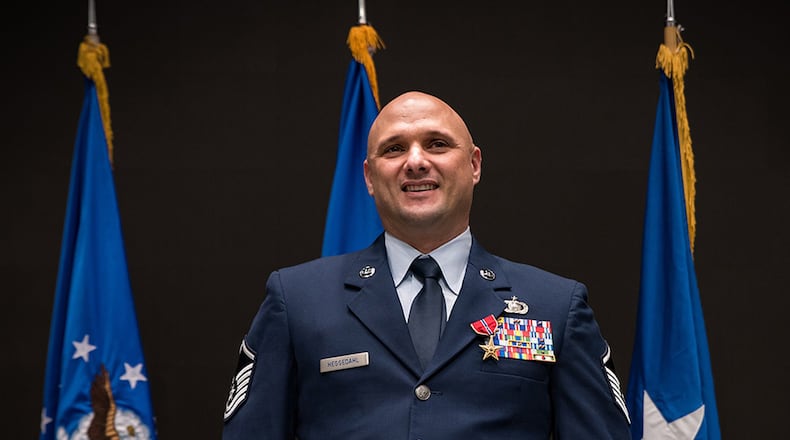 Brig. Gen. James Dienst, commander of the Air Force Research Laboratory’s 711th Human Performance Wing, pins the Bronze Star medal on Master Sgt. Timothy L. Heggedahl during a ceremony at the Air Force Institute of Technology, Wright-Patterson Air Force Base, on Feb. 26. (Skywrighter photo/Richard Eldridge)