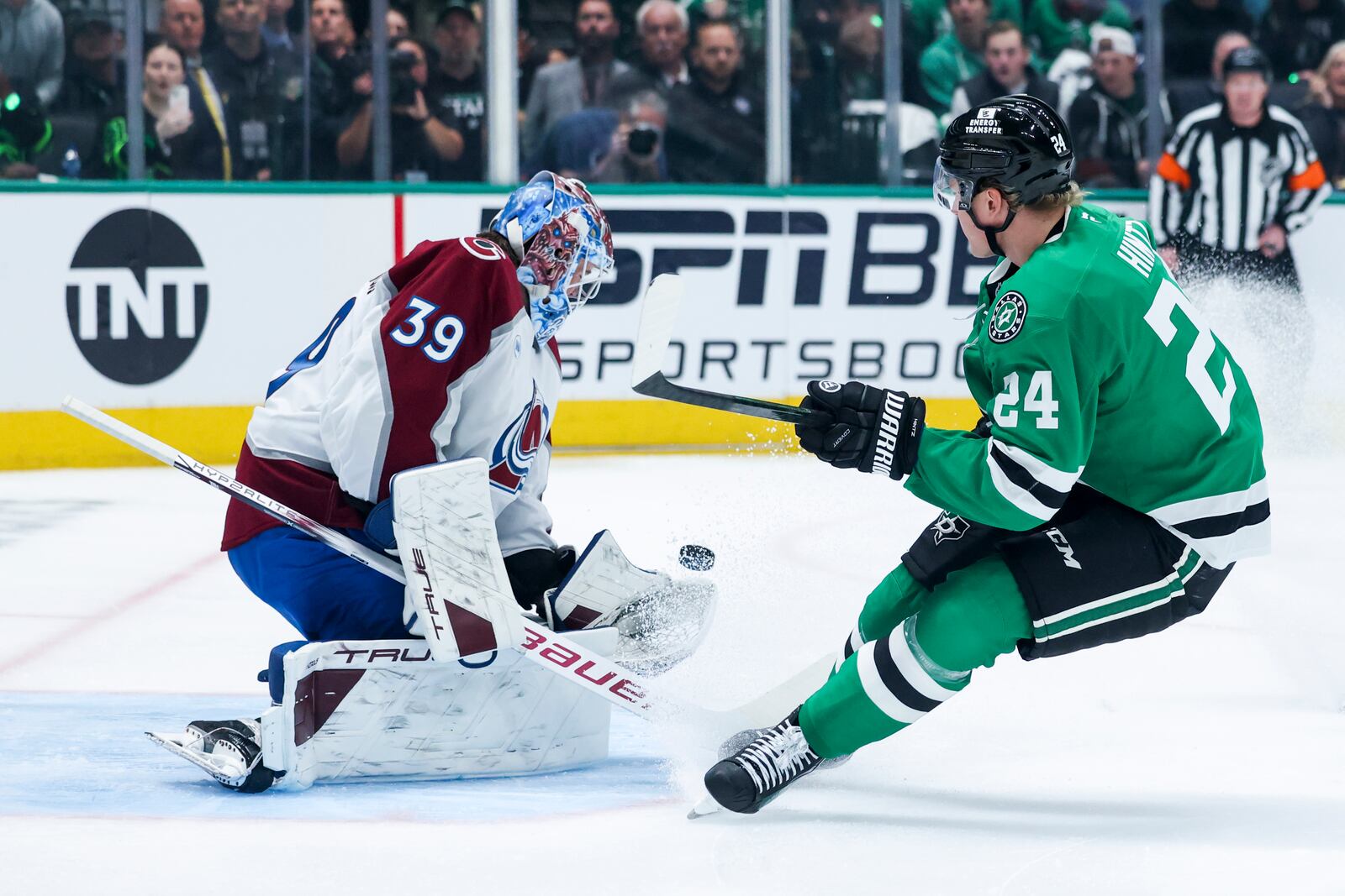 Dallas Stars center Roope Hintz (24) shoots against Colorado Avalanche goaltender Mackenzie Blackwood (39) during a first-round NHL hockey playoff game in Dallas, Saturday, April 19, 2025. (AP Photo/Gareth Patterson)