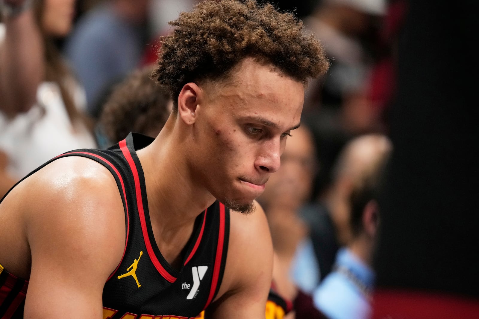 Atlanta Hawks guard Dyson Daniels (5) reacts to a loss on the bench in overtime of an NBA play-in tournament basketball game against the Miami Heat, Friday, April 18, 2025, in Atlanta. (AP Photo/Brynn Anderson)
