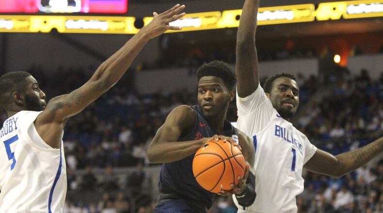 Dayton’s Jalen Crutcher looks to pass against Saint Louis on Saturday, Jan. 27, 2018, at Chaifetz Arena in St. Louis, Mo. David Jablonski/Staff