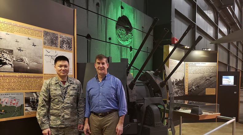 Capt. Yongjun Yoon, a radio frequency sensing engineer from the Radio Frequency Technology Branch at the Air Force Research Laboratory’s Sensors Directorate, and David Sobota, with the Sensors Effects and Analysis Branch, stand in front of a ZPU-4 Soviet-built anti-aircraft gun at the National Museum of the U.S. Air Force. Comprising four KPV 14.5mm heavy machine guns mounted on a four-wheel carriage, the ZPU-4 was used by the Iraqis in 1991 during Operation Desert Storm. The effective range for the anti-aircraft gun was approximately 5,000 feet (1,500 meters). Each gun had a muzzle velocity of approximately 3,300 feet/second (990 meters/second) and a rate of fire of 600 rounds per minute. The metal link belt contained 100 rounds for each gun. AFRL is mostly interested in the longer range, more lethal AAA guns for research. (U.S. Air Force photo)