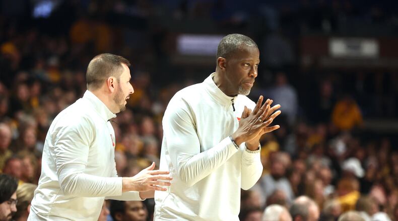 Dayton's Anthony Grant, right, and James Kane coach during a game against Virginia Commonwealth on Friday, March 7, 2025, at the Siegel Center in Richmond, Va. David Jablonski/Staff