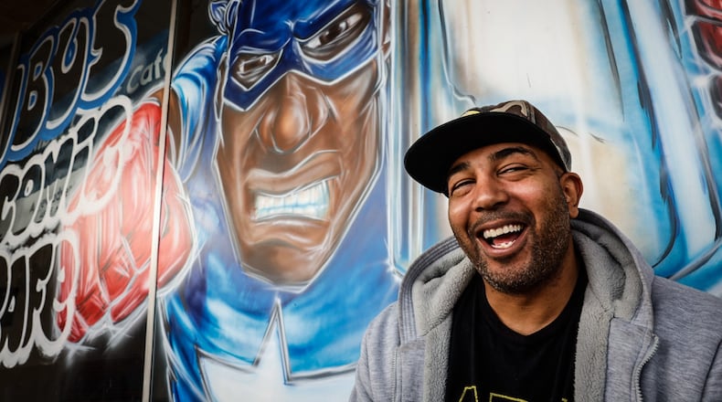 Rob Dejene is the owner of Nimbus Comic Cafe on East Main Street in Trotwood. Dejene sells coffee and vintage comic books. JIM NOELKER/STAFF
