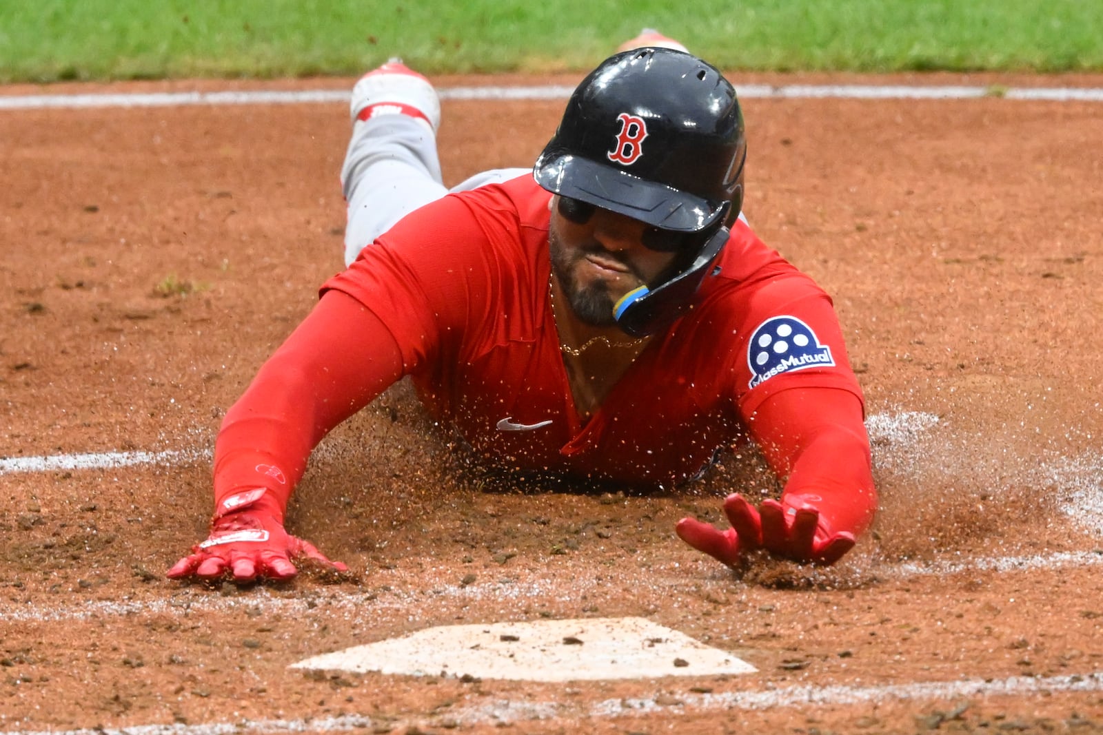 Boston Red Sox's Carlos Narvaez scores on a triple by Jarren Duran during the third inning of the second baseball game of a doubleheader against the Cleveland Guardians, Saturday, April 26, 2025, in Cleveland, (AP Photo/David Richard)