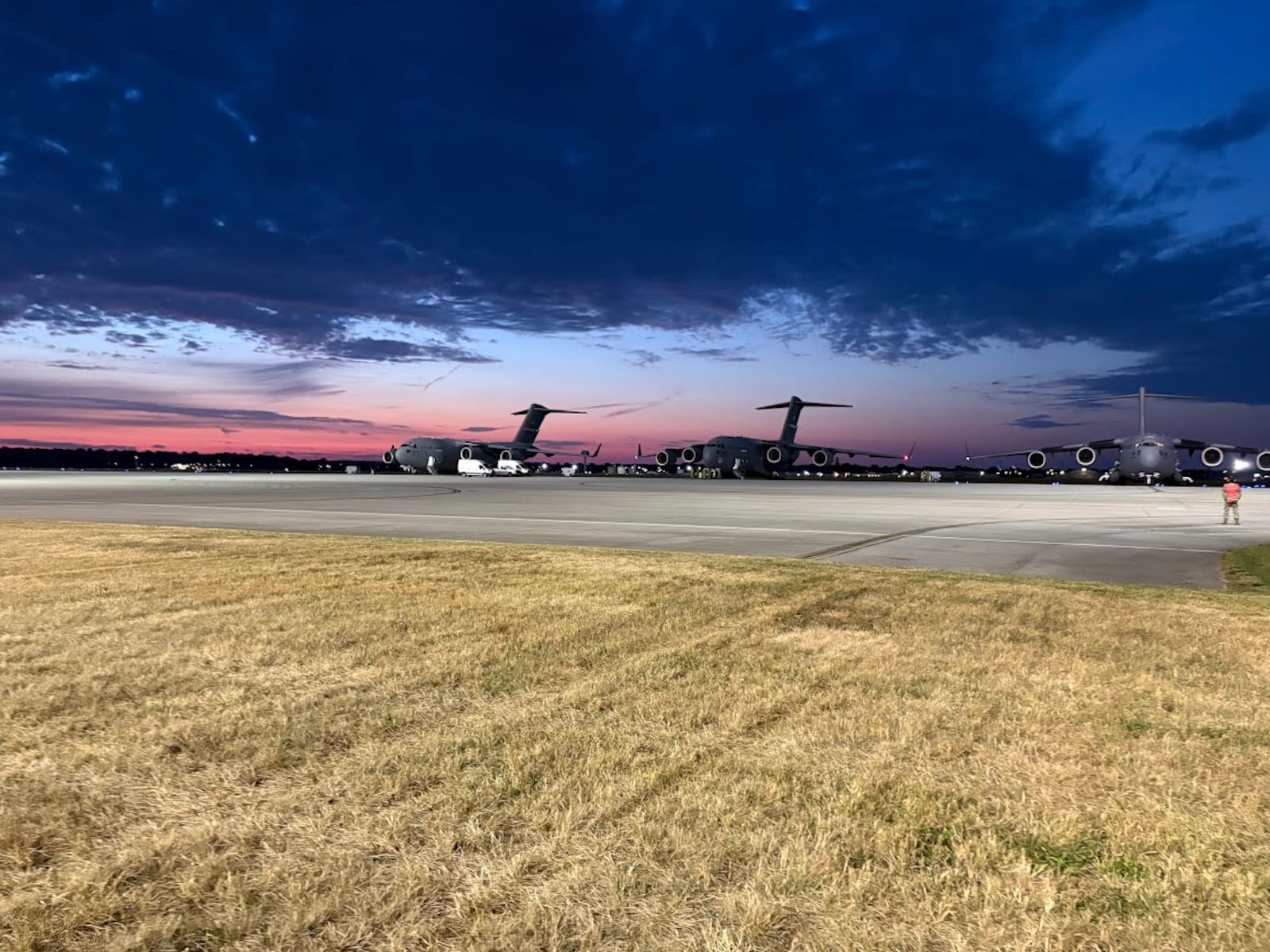 Two 445th Airlift Wing C-17s preparing to taxi on Wright-Patterson Air Force Base on Sunday, Sept. 21, 2025. THOMAS GNAU/STAFF