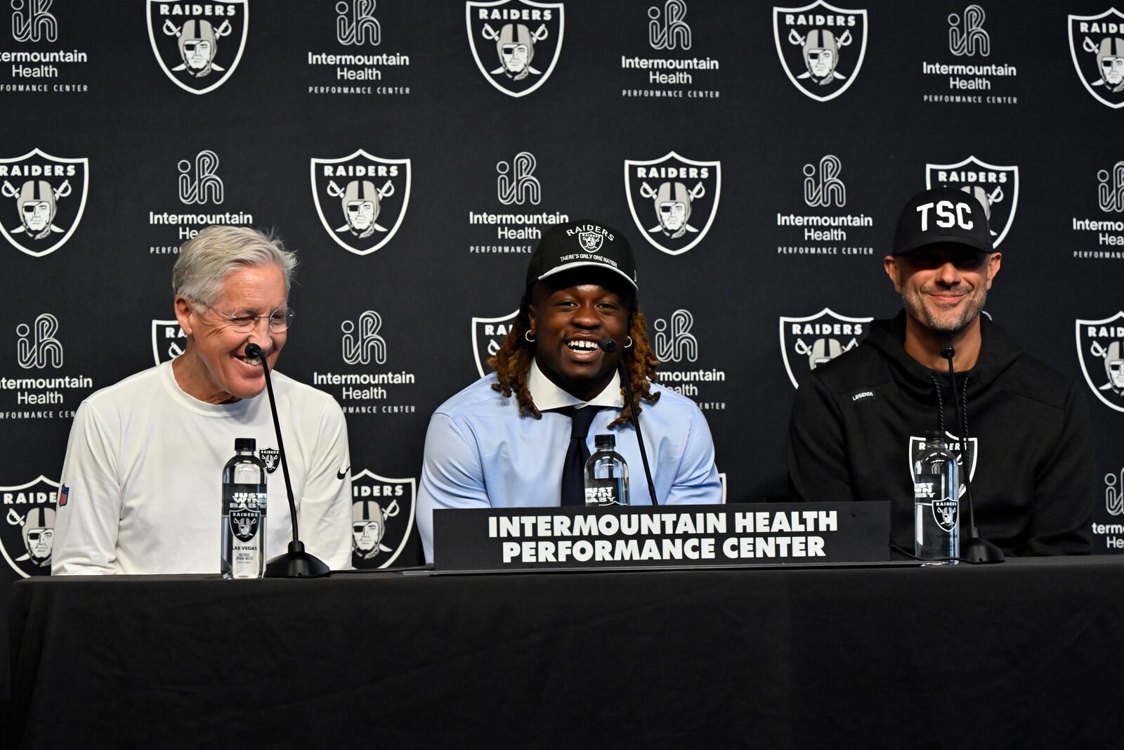 Las Vegas Raiders first-round draft pick Ashton Jeanty, center, speaks as head coach Pete Carroll, left, and general manager John Spytek look on during an NFL football news conference Friday, April 25, 2025, in Henderson, Nev. (AP Photo/David Becker)