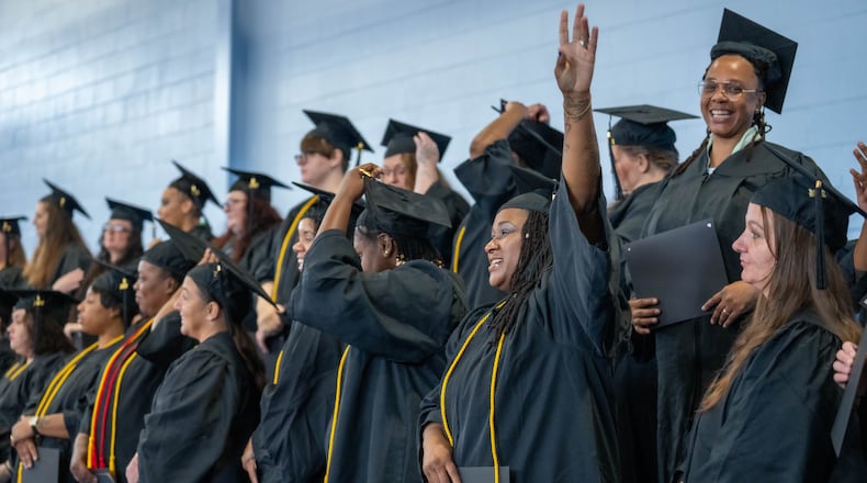 Dayton Correctional Institute women celebrate after getting their diplomas Tuesday, Oct. 1. Courtesy of Sinclair Community College