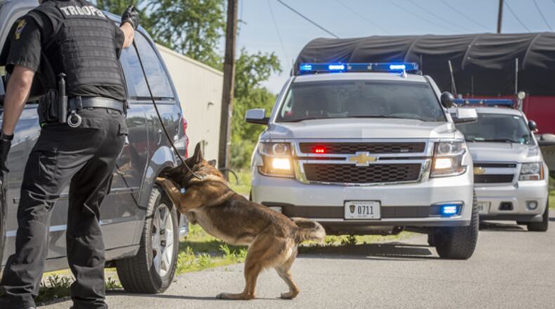 The Warren County Drug Task Force partners with several communities and local law enforcement agencies and Ohio State Highway Patrol troopers and their K9s to detect and seize illegal drugs being transported in the county. FILE PHOTO