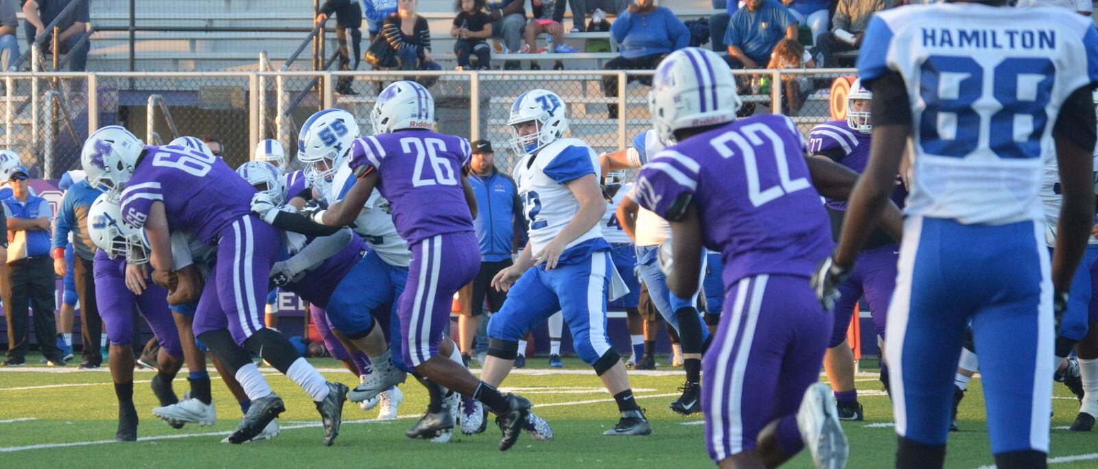 Hamilton’s Maleek Jarrett (8) carries the Middletown defense, including Gene Underhill (66), for extra yardage during Friday night’s game at Barnitz Stadium in Middletown. CONTRIBUTED PHOTO BY MARITZA MCKINNEY