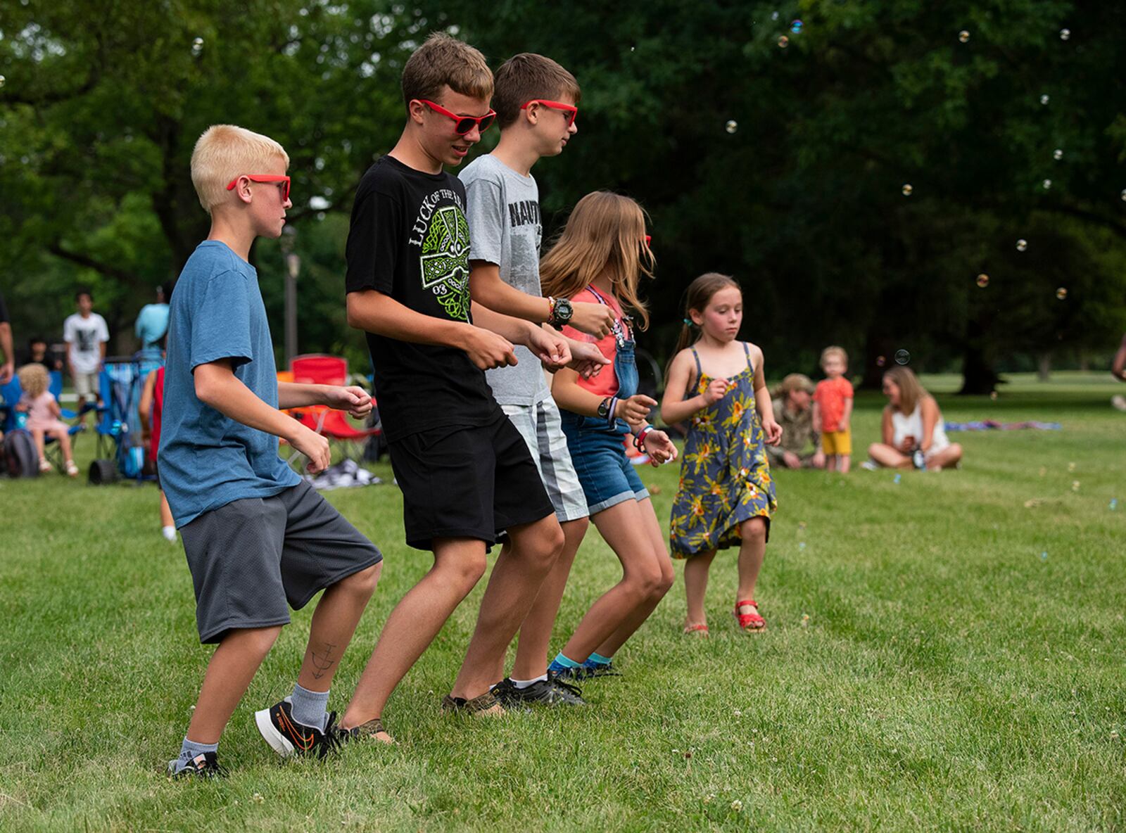 Neighborhood kids line up to dance at a block party sponsored by the 88th Force Support Squadron on June 24 at Turtle Pond in the Brick Quarters historic district on Wright-Patterson Air Force Base. The party, the first in a series of three through the summer, was free to all Wright-Patt community members. U.S. AIR FORCE PHOTO/R.J. ORIEZ