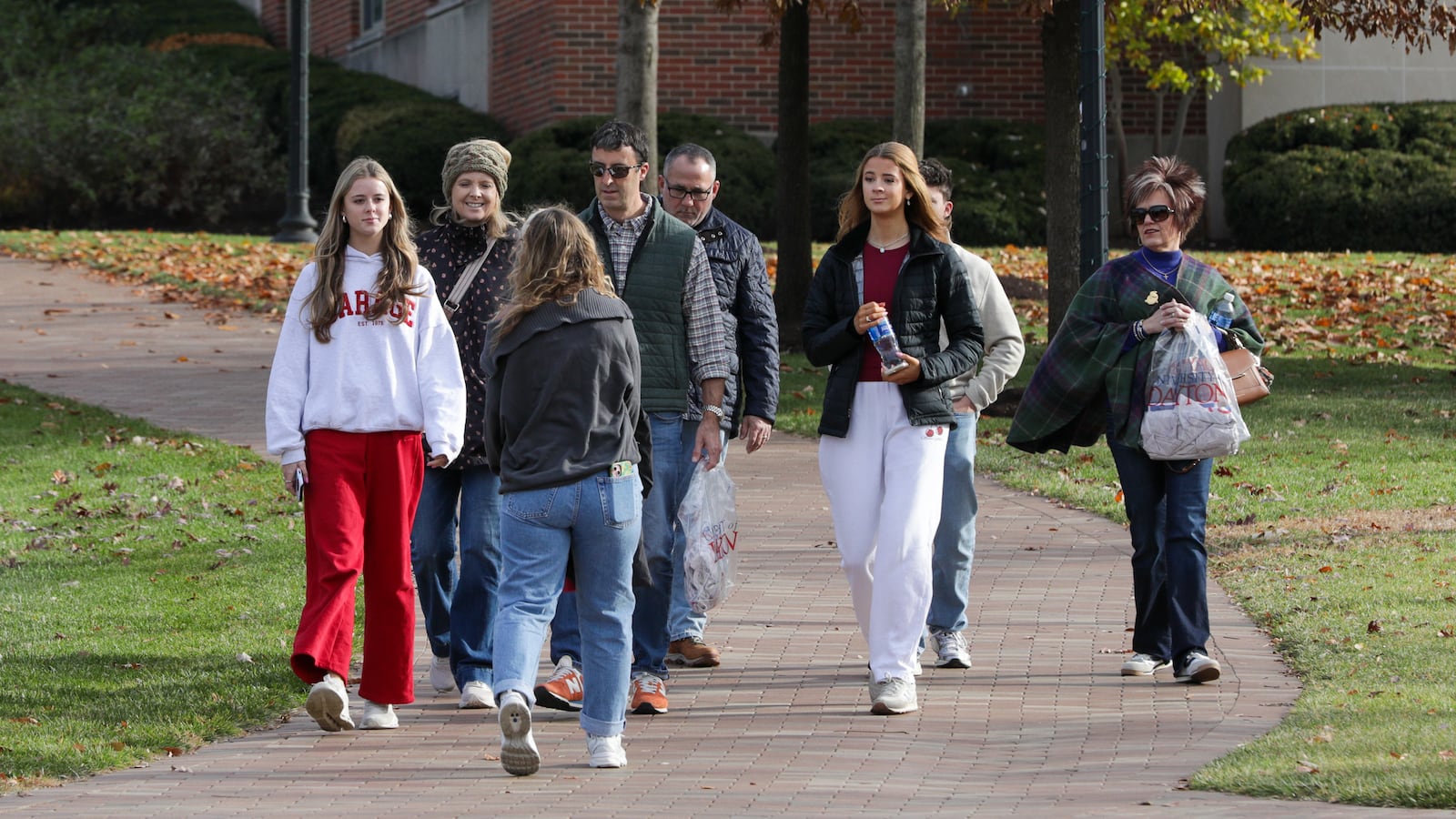 A tour group walks on the University of Dayton campus on Monday, Nov. 24. A total of 9,713 students are attending UD this fall, according to their data, and about 6,949 undergraduate students are registered. BRYANT BILLING/STAFF