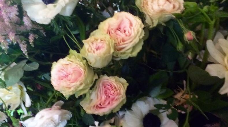 An arrangement designed by Barbara Schneider in the English Garden style. Schneider and her husband created unique one of kind arrangements that are a departure from the traditional florist style. CONTRIBUTED