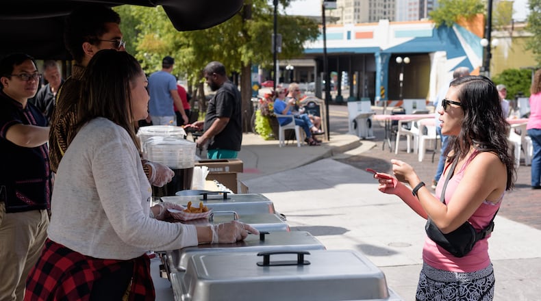 Sip and snack your way through Dayton’s Oregon District on Saturday, Sept. 14. from noon to 6 p.m. with the return of its signature tasting event. TOM GILLIAM / CONTRIBUTING PHOTOGRAPHER