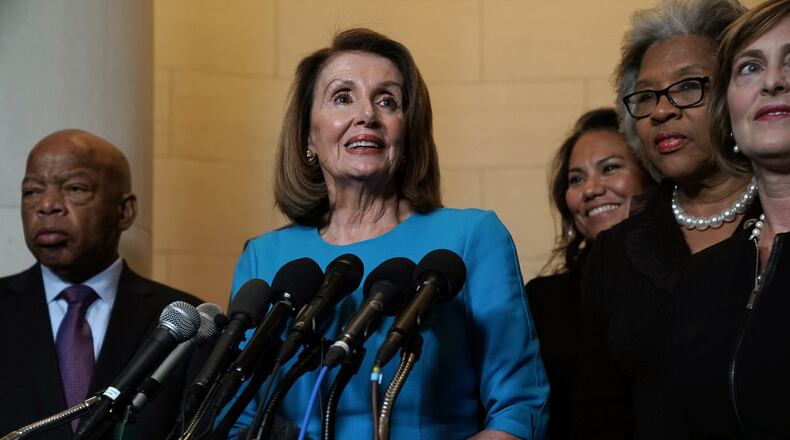 U.S. House Minority Leader Rep. Nancy Pelosi, D-Calif., speaks to members of the media along with other members of the House Democratic caucus. Rep. Joyce Beatty, D-Ohio, is second from the right. (Photo by Alex Wong/Getty Images)