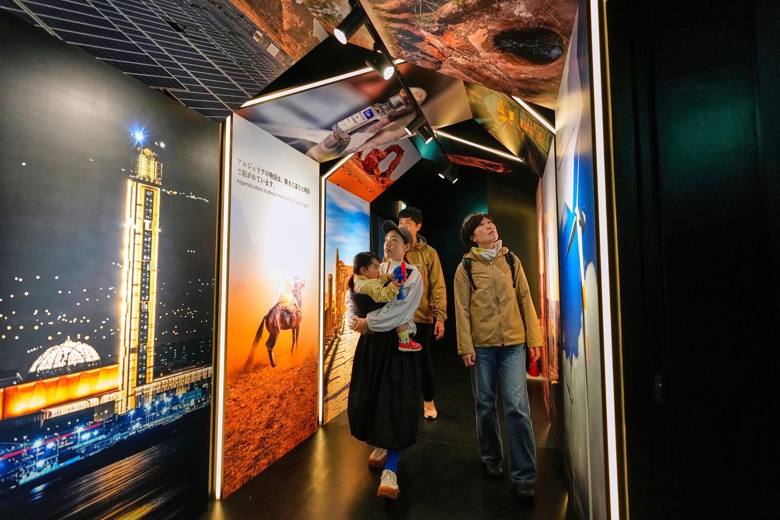 People visit Algeria's pavilion during the Expo 2025 in Osaka, western Japan, Tuesday, April 15, 2025. (AP Photo/Hiro Komae)