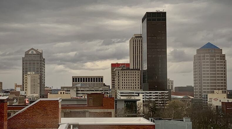 Dark clouds loom over downtown Dayton on Thursday, Jan. 19, 2023. MARSHALL GORBY/STAFF