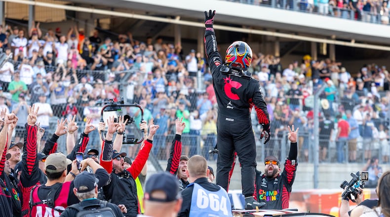 23XI Racing's Tyler Reddick, center, celebrates his win during a NASCAR Cup Series auto race in Austin, Texas, Sunday, March 1, 2026. (AP Photo/Stephen Spillman)