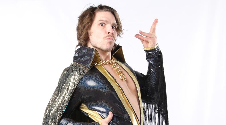 Dalton Castle, real name Brett Giehl, is a highly decorated amateur wrestler, with 10 years experience through college. He went against type for his Dalton Castle persona, a mix of Gorgeous George, Freddie Mercury, David Bowie and Prince. Along with Brett and Brandon Tate, The Boys, the trio are one of the most popular acts in ROH.