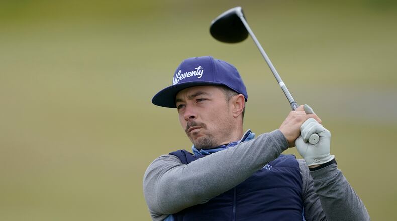 Danny Woodhead, a former NFL football running back, tees off on the first hole during a practice round for the U.S. Amateur Four-Ball golf championship, Friday, May 21, 2021, at Chambers Bay in University Place, Wash. The tournament is the first major USGA event hosted at the course since the 2015 U.S. Open. (AP Photo/Ted S. Warren)