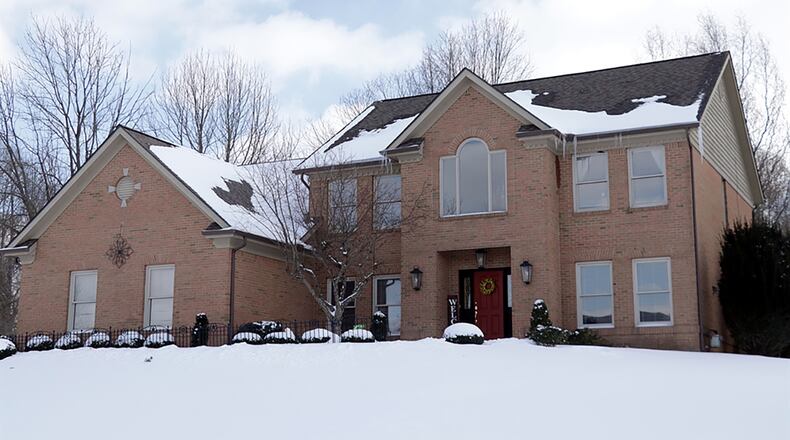 The 2-story home with 4 or 5 bedrooms has about 4,750 sq. ft. of living space, including the finished basement. The brick house sits on a half-acre corner lot and has a side-entry, 3-car garage. CONTRIBUTED PHOTO BY KATHY TYLER