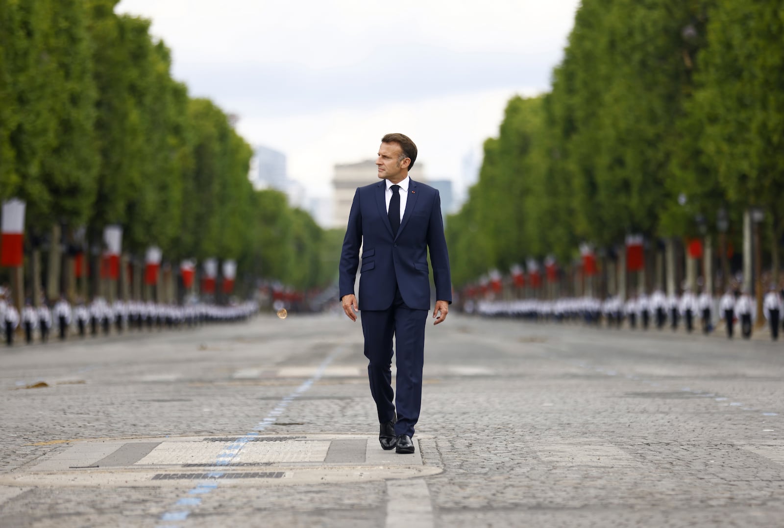 French President Emmanuel Macron arrives to the Bastille Day military parade on the Champs-Elysees avenue, Monday July 14, 2025. (Mohammed Badra, Pool via AP)