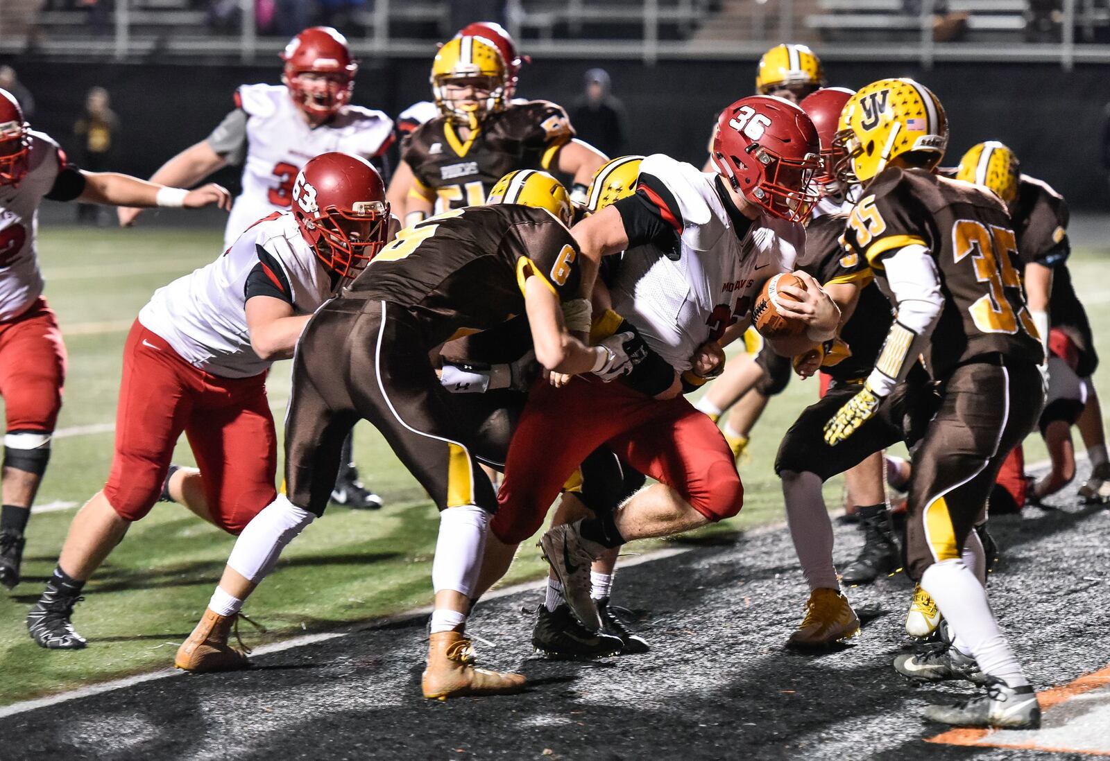 Madison’s Cole Pelgen carries the ball across the goal line for a touchdown during Friday night’s 42-7 victory over West Jefferson in the Division V, Region 20 title game at Beavercreek. NICK GRAHAM/STAFF