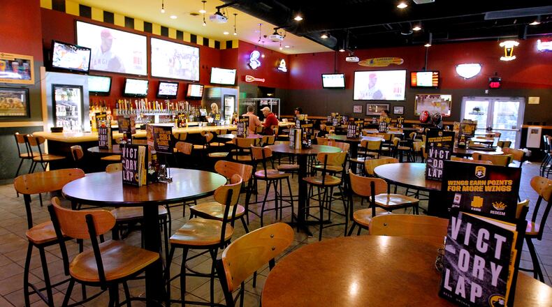 This file photo from 2017 shows the Buffalo Wild Wings on Bechtle Avenue in Springfield prior to a renovation project. File photo by Bill Lackey/Staff