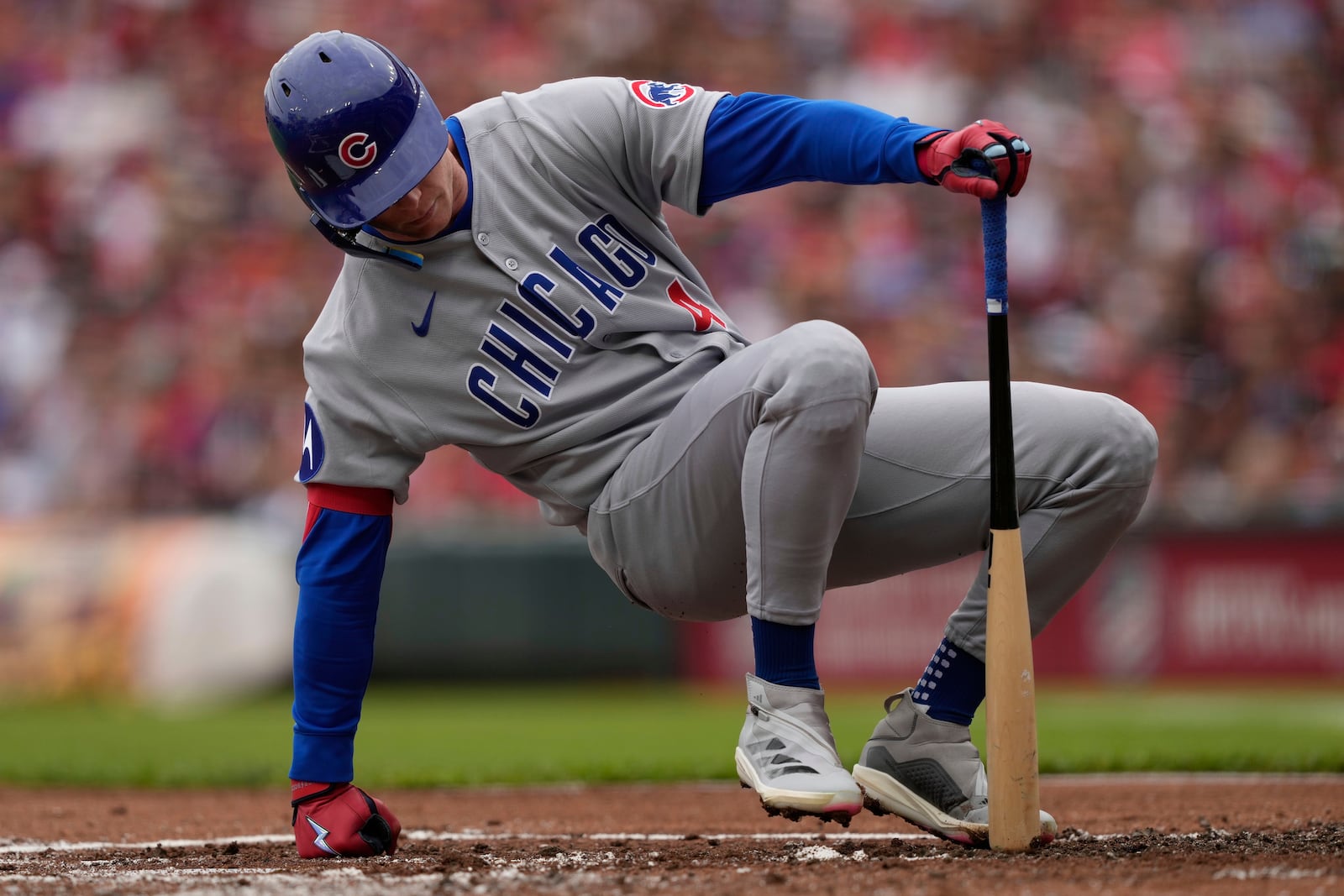 Chicago Cubs outfielder Pete Crow-Armstrong gets up after diving from a pitch thrown by Cincinnati Reds pitcher Nick Lodolo in the first inning of a baseball game, Sunday, May 25, 2025, in Cincinnati. (AP Photo/Carolyn Kaster)