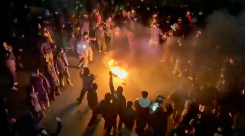 FILE - This frame grab from footage circulating on social media shows protesters dancing and cheering around a bonfire as they take to the streets despite an intensifying crackdown as the Islamic Republic remains cut off from the rest of the world, in Tehran, Iran, Jan. 9, 2026. (UGC via AP, File)