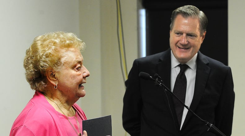 U.S. Rep. Mike Turner listens to Judy Church, wife of the late Miamisburg Mayor Richard C. Church Jr., as she talks about her husband at a press conference Thursday, Aug. 24, 2023 at the Mound Science Museum. Parts of a roadway connector between Interstate 75 and southern Miamisburg will be named the Richard C. Church Jr. Connector. MARSHALL GORBY\STAFF