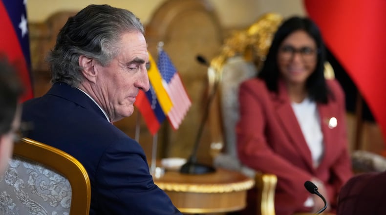 Venezuela's acting President Delcy Rodriguez, behind, and U.S. Interior Secretary Doug Burgum meet Miraflores presidential palace in Caracas, Venezuela, Wednesday, March 4, 2026. (AP Photo/Ariana Cubillos)