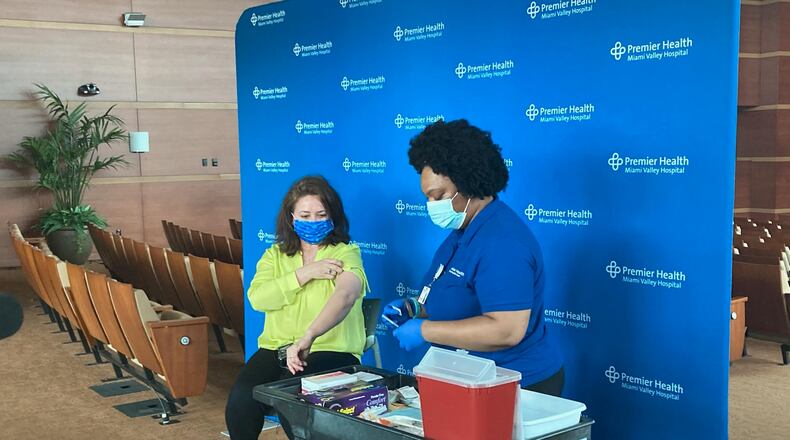 Claudia Cortez-Reinhardt receives her vaccine at the Kroc Center. KAITLIN SCHROEDER