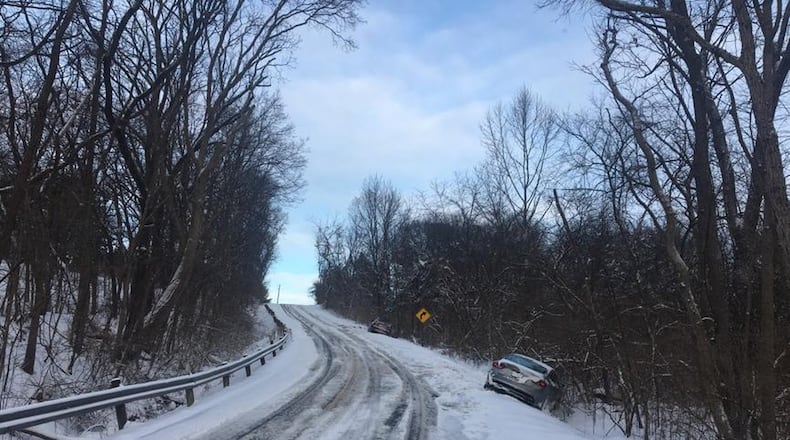 Deputies blocked a portion of Brush Row Road between Stevenson and Mason roads in Greene County due to several slide-offs Sunday. (Noah Fickert/Staff)