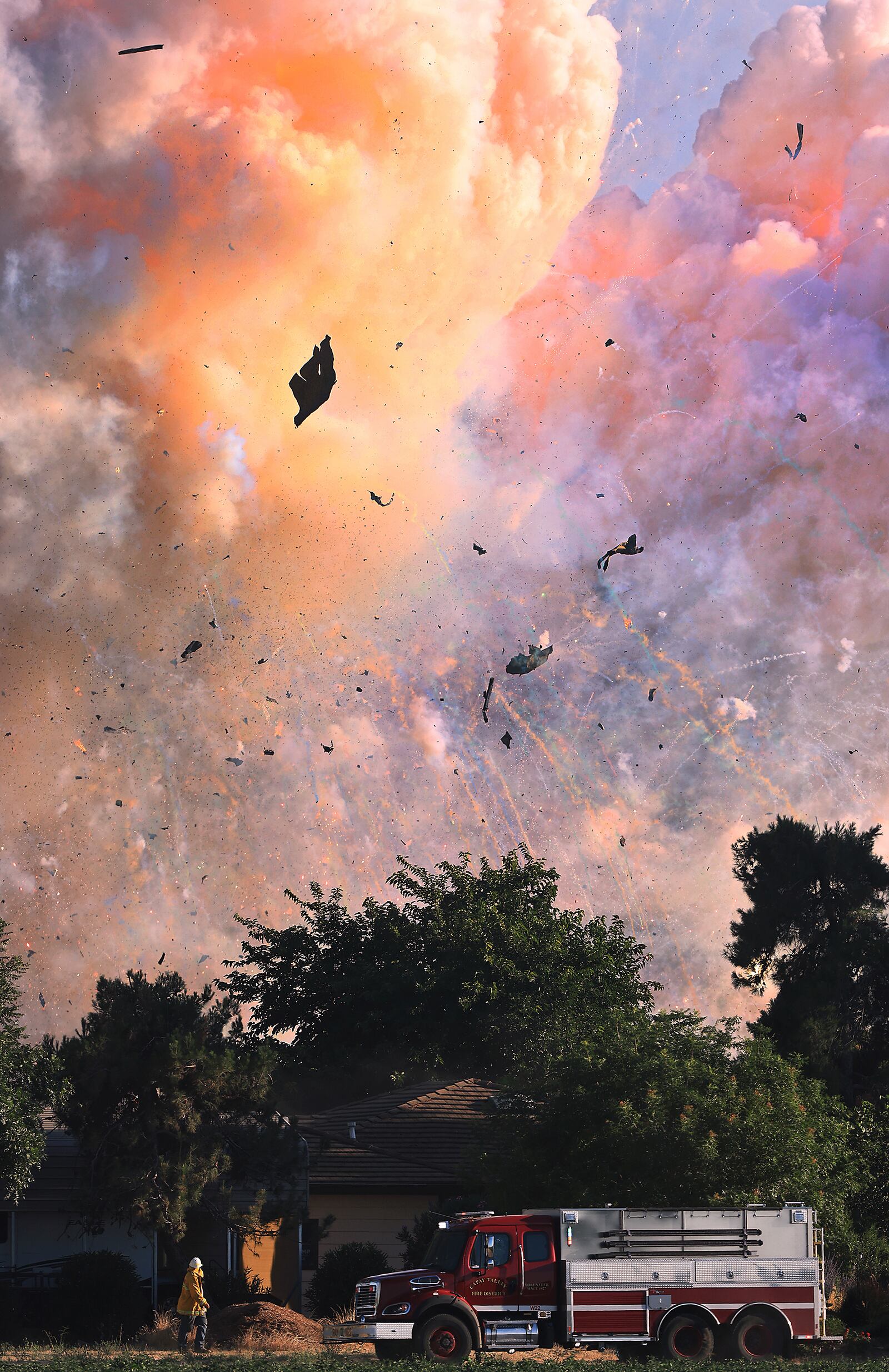 Fireworks explode at a fireworks warehouse near Esparto, Calif., Tuesday, July 1, 2025. (Kent Porter/The Press Democrat via AP)