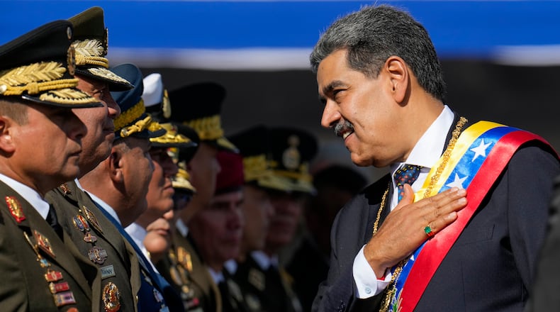 FILE - Venezuela's President Nicolas Maduro places his hand over his hear while talking to high-ranking officers during a military ceremony on his inauguration day for a third term, in Caracas, Venezuela, Jan. 10, 2025. (AP Photo/Ariana Cubillos, File)