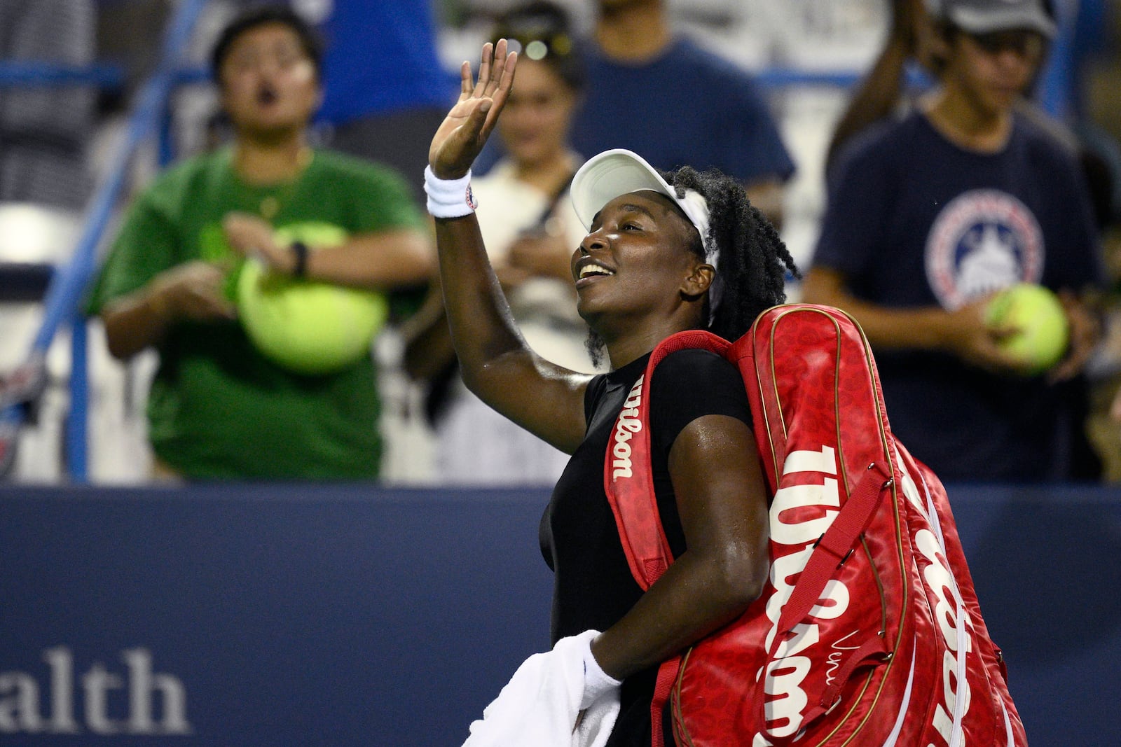 Venus Williams waves to the crowd as she leaves the court after she lost to Magdalena Frech, of Poland, during a match at the Citi Open tennis tournament Thursday, July 24, 2025, in Washington. (AP Photo/Nick Wass)