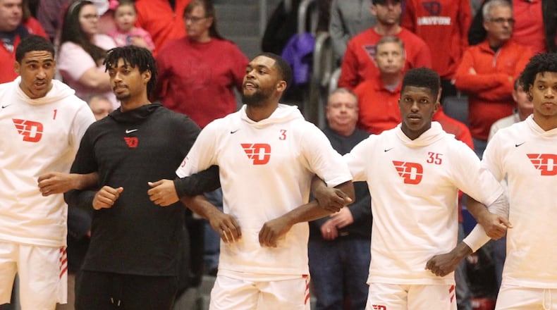 Dayton players stand for the national anthem before a game against Purdue Fort Wayne on Friday, Nov. 16, 2018, at UD Arena.