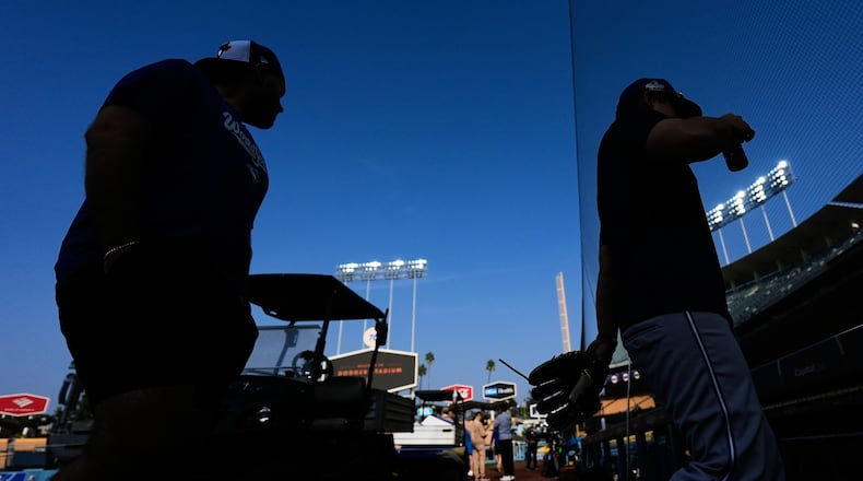 Toronto Blue Jays players work out ahead of Game 3 of the 2025 World Series against the Los Angeles Dodgers in Los Angeles, Sunday, Oct. 26, 2025. (AP Photo/Ashley Landis)