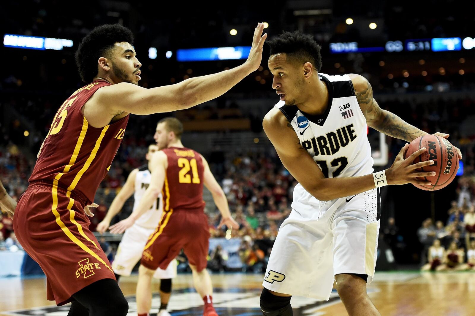 MILWAUKEE, WI - MARCH 18: Vince Edwards #12 of the Purdue Boilermakers handles the ball while being guarded by Nazareth Mitrou-Long #15 of the Iowa State Cyclones in the second half during the second round of the 2017 NCAA Tournament at BMO Harris Bradley Center on March 18, 2017 in Milwaukee, Wisconsin. (Photo by Stacy Revere/Getty Images)