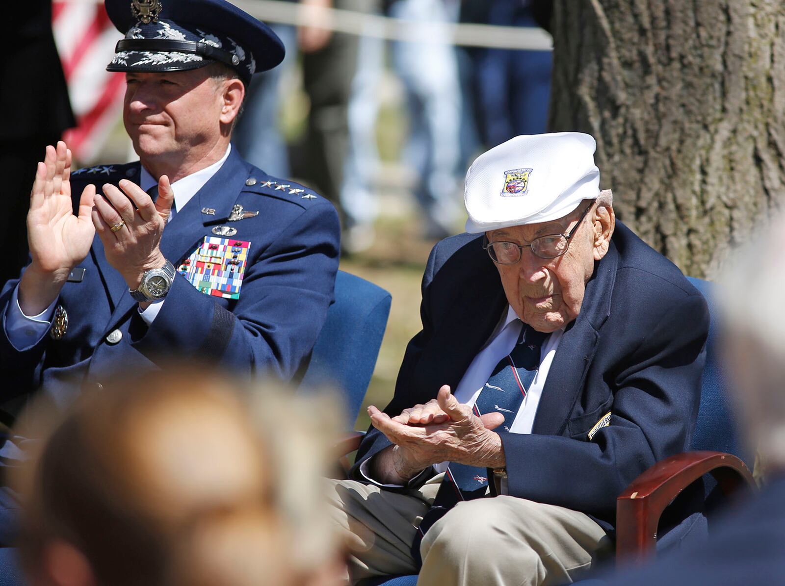 A Doolittle Tokyo Raiders memorial service and commemoration took place at the National Museum of the United States Air Force marking the 75th anniversary of the mission. Of the 80 Raiders, Dayton native Lt.Col. Richard E. Cole, 101, right, is the last survivor, and was reviled by Air Force Chief of Staff Gen. David Goldfein, left.   TY GREENLEES / STAFF