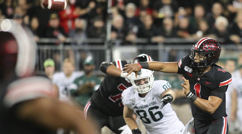 Ohio State’s Justin Fields throws a touchdown pass against Michigan State on Saturday, Oct. 5, 2019, at Ohio Stadium in Columbus. David Jablonski/Staff