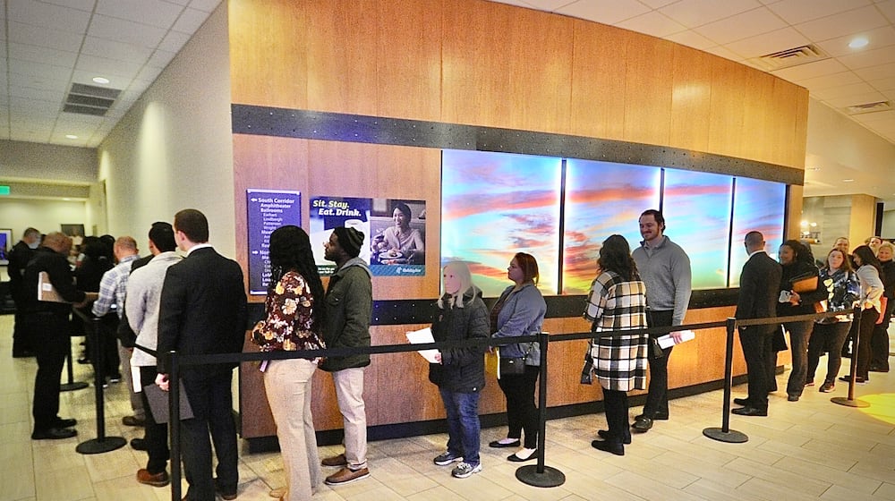 Jobseekers wait in line at what was the Fairborn Holiday Inn for the Air Force Life Cycle Management hiring event event March 22, 2023. FILE