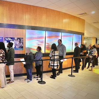 Jobseekers wait in line at what was the Fairborn Holiday Inn for the Air Force Life Cycle Management hiring event event March 22, 2023. FILE