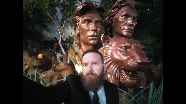 Daytonian of the Week Andy Rowe in front of a Siegfried and Roy statue in Las Vegas?