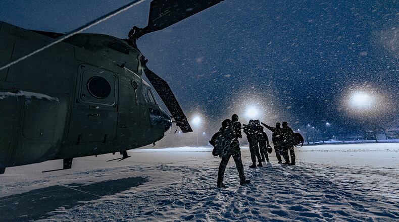 U.S. Army aircrew from Company B, 2nd Battalion, 238th General Support Aviation, Peoria, Ill., walk away from their CH-47 Chinook after a night mission during exercise Northern Strike 21 at Alpena Combat Readiness Training Center, Michigan, last January. This year's exercise will unite servicemembers from several states and partner forces at Camp Grayling Joint Maneuver Training Center and ACRTC on Jan. 21-30. U.S. AIR NATIONAL GUARD PHOTO/MASTER SGT. SCOTT THOMPSON