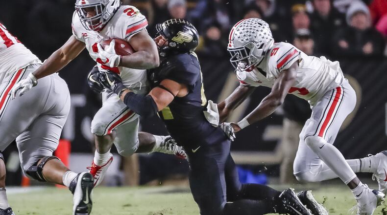 WEST LAFAYETTE, IN - OCTOBER 20: J.K. Dobbins #2 of the Ohio State Buckeyes runs the ball as Markus Bailey #21 of the Purdue Boilermakers hangs on for the stop at Ross-Ade Stadium on October 20, 2018 in West Lafayette, Indiana. (Photo by Michael Hickey/Getty Images)