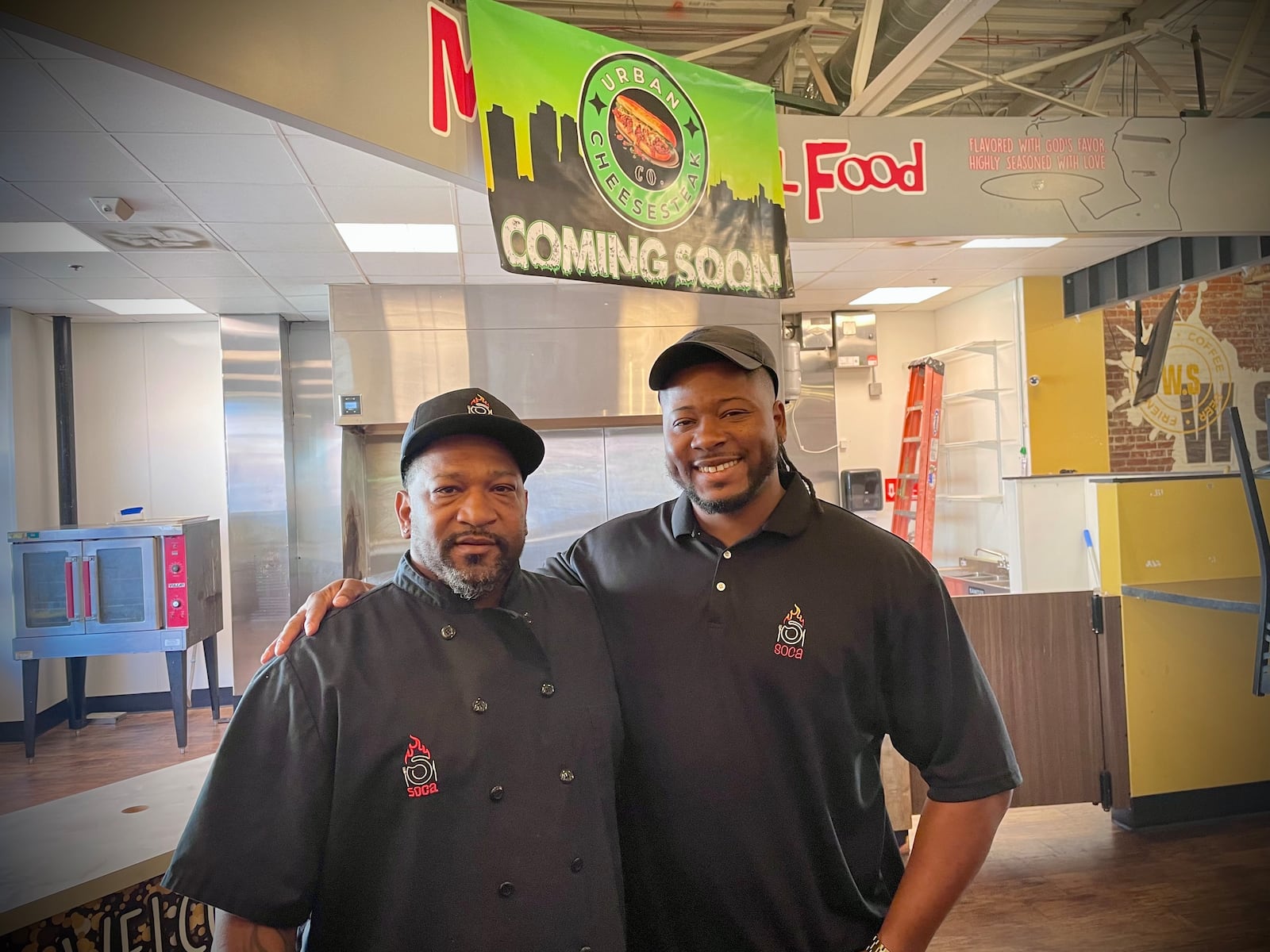 Shafton Greene (left), the owner of SOCA, is opening Urban Cheesesteak Co. with his son, Shafton “Wesley” Greene Jr. (right), inside W. Social Tap & Table in Dayton. NATALIE JONES/STAFF