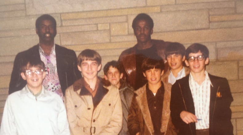 Getting autographs after Michigan’s 81-78 victory over the Dayton Flyers at UD Arena in December of 1972: Front row (left to right): Steve Martin, Vince Martin, Paul Donoher, Mike Zimmerman, Jack Zimmerman and Tim Gallagher. Back row is the Wolverines 6-foot-10 center Ken Brady (left) and All-American forward Campy Russell (right.) When Michigan’s bus broke down in Arena parking lot after game, Brady and Russell got a ride back to the team’s Imperial House South hotel with the kids in the “big boat of a Oldsmobile” driven by Tim’s dad Jim Gallagher. CONTRIBUTED