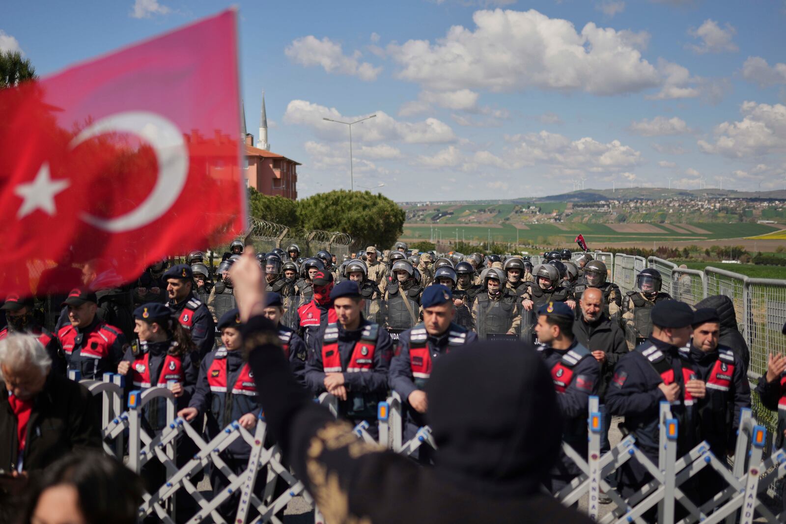 Turkish gendarmerie block the way as supporters gather outside Silivri prison, where a hearing is taking place for Istanbul jailed Mayor Ekrem Imamoglu in one of multiple cases against him, west of Istanbul, Turkey, Friday, April 11, 2025. (AP Photo/Francisco Seco)