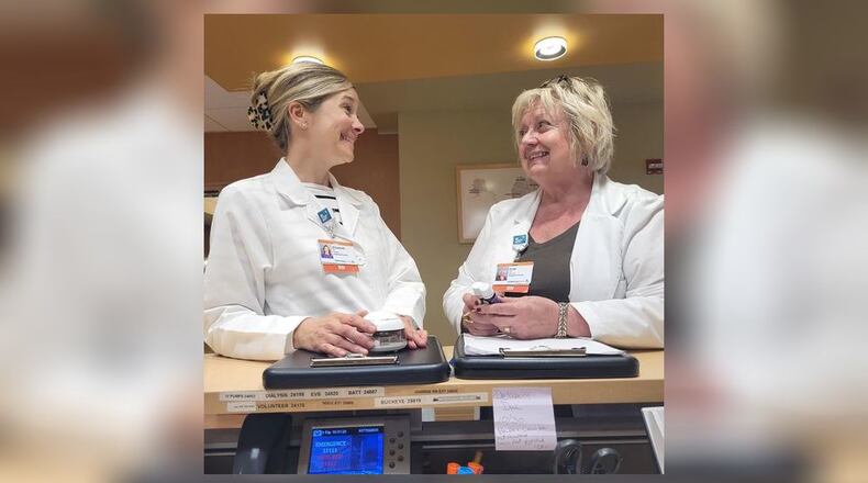 Patti McCormick, RN, PhD, left, is seen preparing Clinical Aromatherapy Care Plans for patients at Soin Medical with Elizabeth Madren, a graduate of IHL and a Certified Holistic Health practitioner.